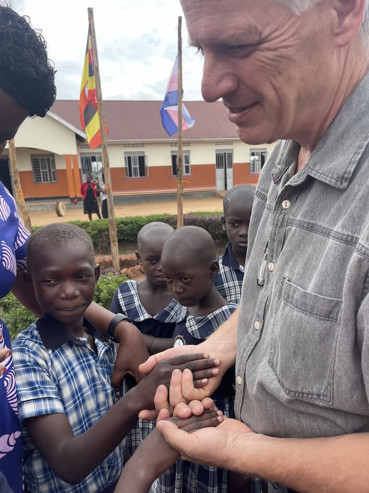 Holding hands with Uganda Orphans