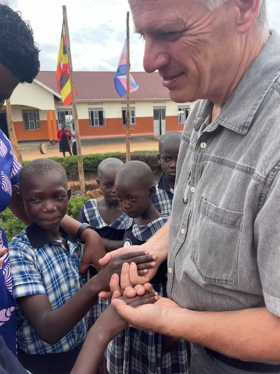 Mark with orphans in Uganda